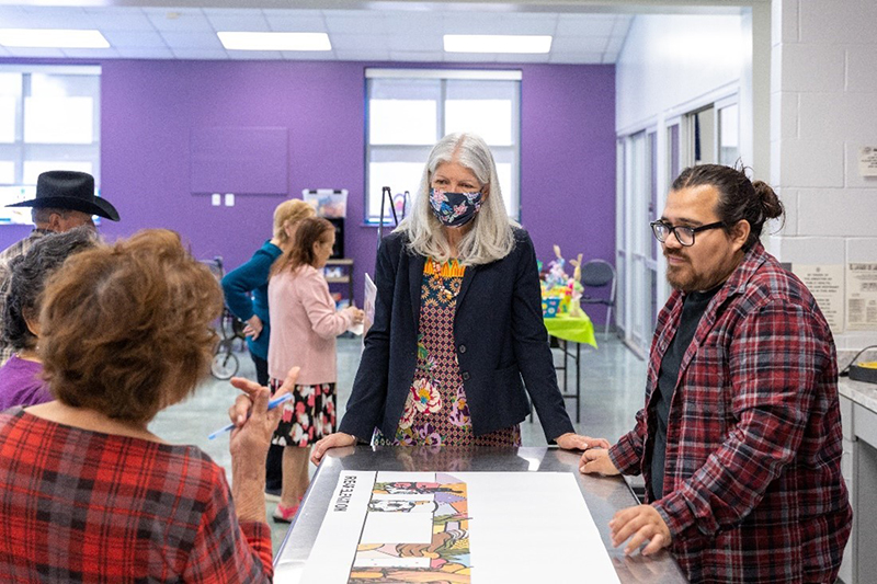 Artist David Maldonado with Council Member Karla Cisneros and Denver Harbor community members