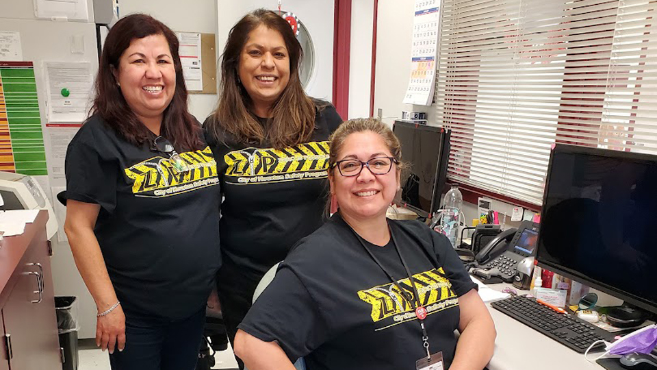 COH employees in the office wearing zip shirts