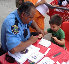Houston police officers and members of the Greater Houston Loss Prevention Alliance (GHLPA) took time out of their schedules today (May 3) to fingerprint children and offer safety tips to shopping parents at Target on 2580 Shearn.